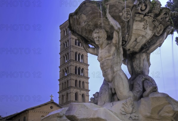 Triton Fountain with bell tower of Santa Maria in Cosmedin, Forum Boarium, Rome Rome, Italy