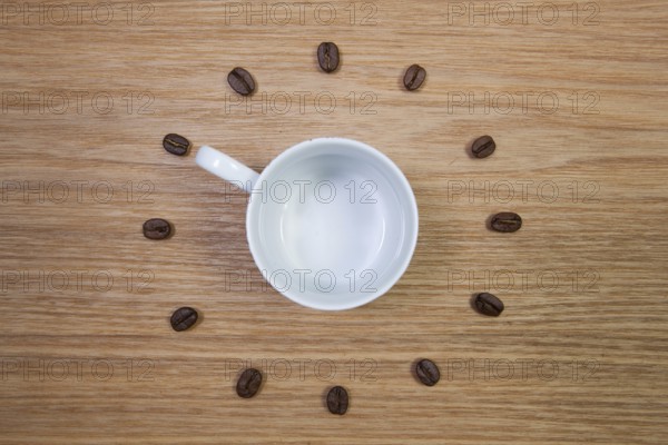 Coffee Time - Empty coffee cup and clock of coffee beans