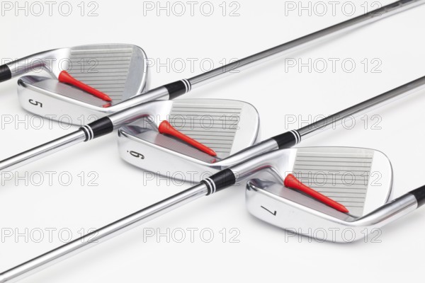 Titanium golf clubs on the white background