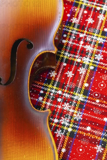 Photo of old violin on Christmas decoration. Winter holidays. Merry christmas and happy new year concept