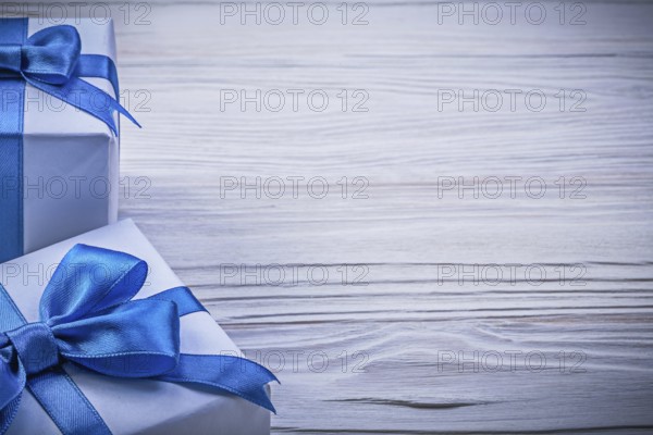 Set of wrapped present boxes on wooden board copy space celebrations concept