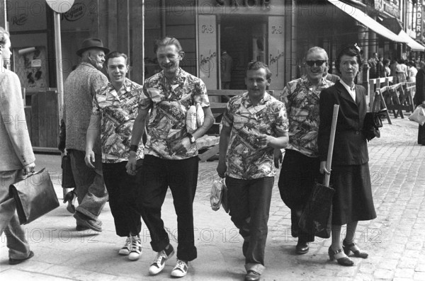 The four tourists 1954. Four men on a street are wearing the same type of shirt. Sweden Kristoffersson ref 1-23