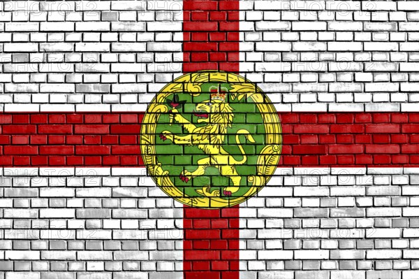 Flag of Alderney painted on brick wall