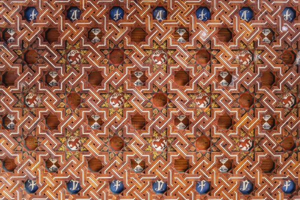 Toledo, Spain, December 6, 2019: Wooden coffered ceiling in the upper level of the cloister of San Juan de los Reyes. Geometric design with moorish influences