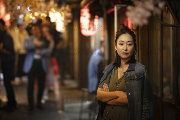 TOKYO, JAPAN - MAY 12, 2019 - People working in bars in Omoide Yokocho or 'Piss Alley' which is a famous laneway in Shinjuku, central Tokyo, Japan, Tokyo, Japan