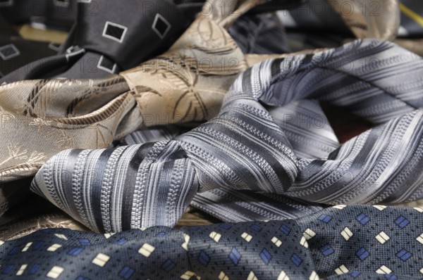A variety of neckties knotted closeup