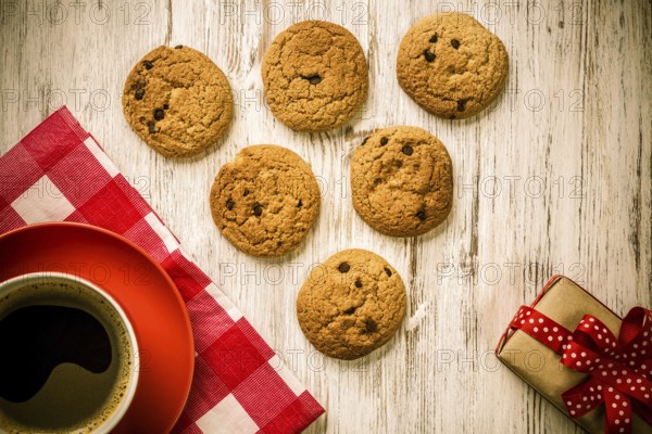 Cup of coffee and cookies on rustic wooden table