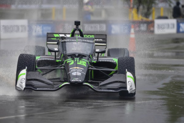 INDYCAR Series driver, AGUSTIN HUGO CANAPINO (R) (78) of Arrecifes, Argentina, travels through the turns during a wet and dangerous practice session for the Big Machine Music City Grand Prix at Streets of Nashville in Nashville TN