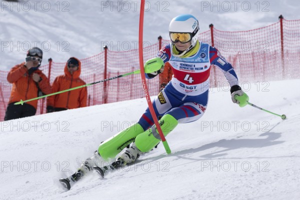 MOROZNAYA MOUNT, KAMCHATKA PENINSULA, RUSSIA, MAR 29, 2019: Mount skier Fedorova Ksenia Moscow skiing down mount slope. Russian Alpine Skiing Cup, International Ski Federation Championship, slalom