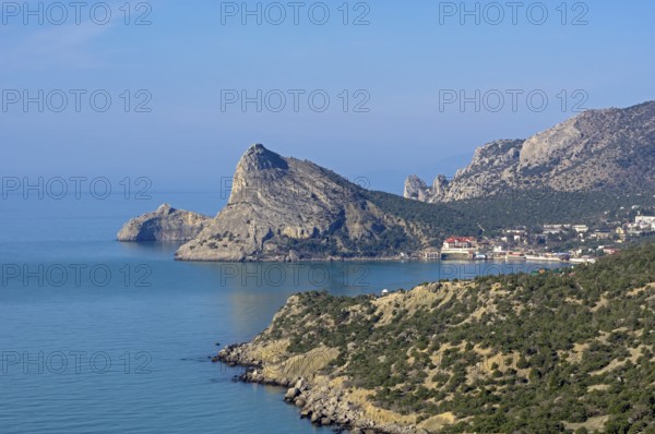 Seascape. View of the resort village Novy Svet from the top of the coastal mountain. Crimea. Sunny morning at the end of April