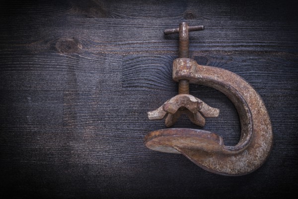 Old clamp on vintage wood board