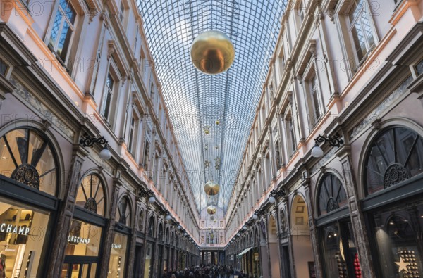 Brussels, Belgium, 12 18 2018: Glass roof and facades of the Saint Hubertus Gallery in Art Nouveau style with Christmas decoration