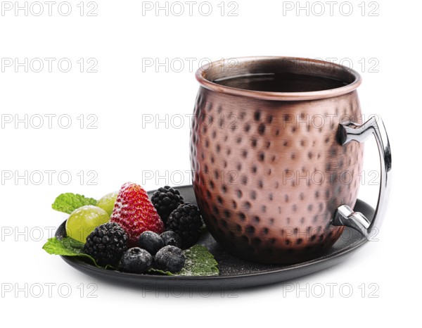 food still-life, Metal camp mug with tea with berries