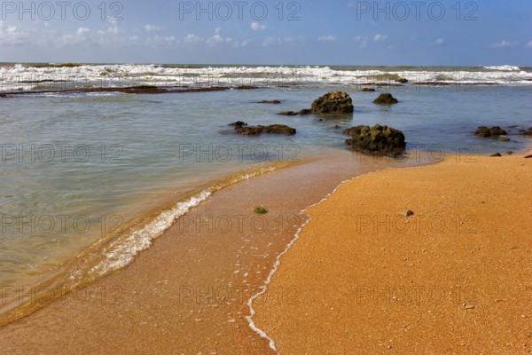 Coast of Mediterranean sea with big stones in water