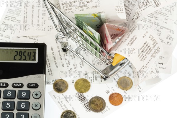 Shopping trolleys, banknotes and receipts, symbolising purchasing power, consumption and inflation Austria