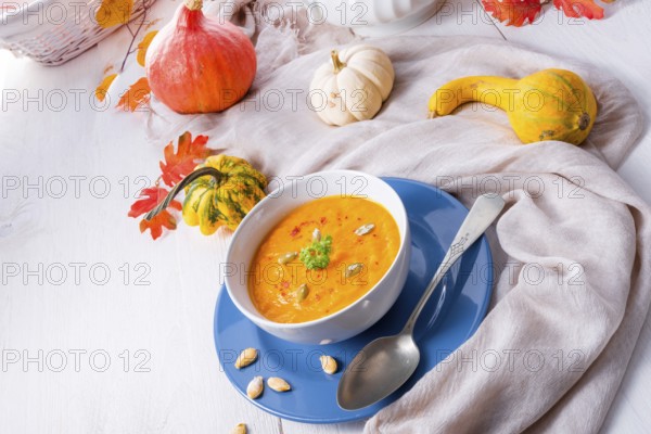 Healthy pumpkin soup with ginger carrots and coconut milk