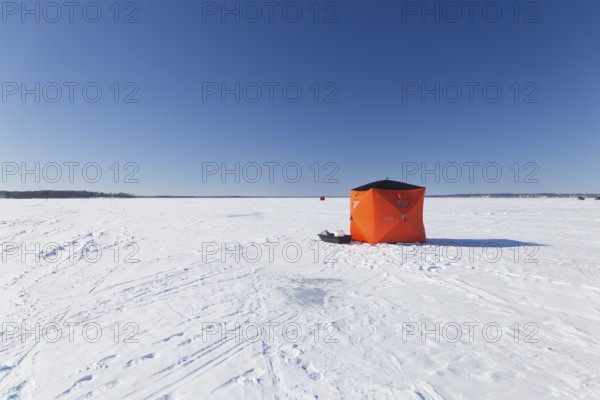 Winter, icefishing tent on the frozen Saint Lawrence River, Province of Quebec, Canada