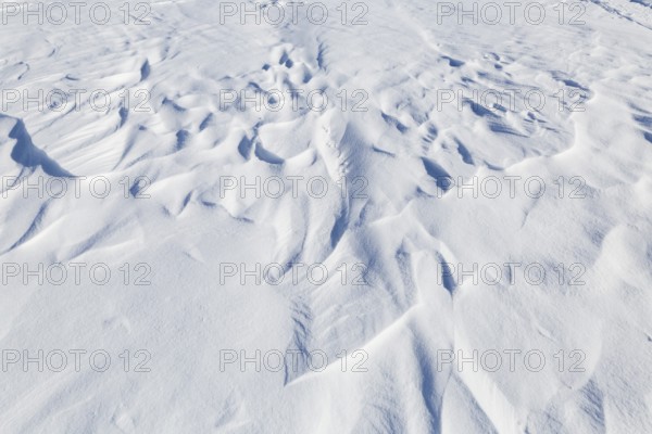 Winter, snowdrift pattern on a frozen river, Province of Quebec, Canada
