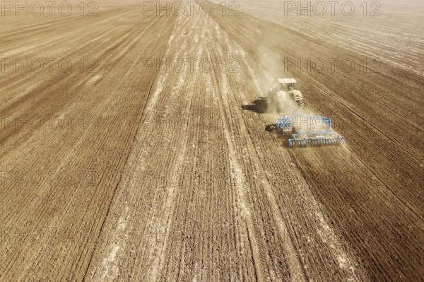 Aerial view Tractor preparing field, Agriculture tractor landscape
