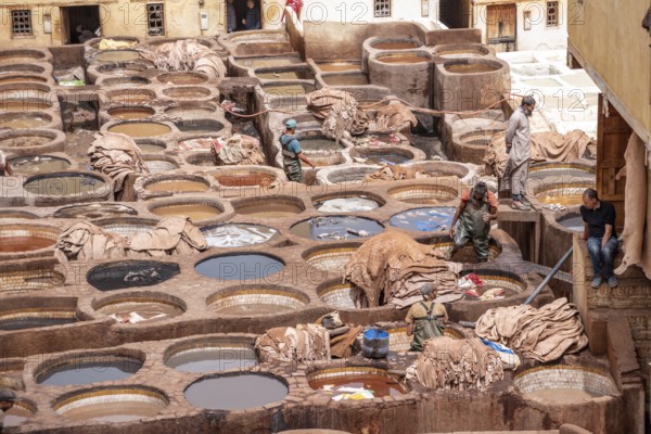 FES, MOROCCO, ARIL 10, 2023, Famous tannery in the medina of Fes, where leather is being processed for generations, Morocco