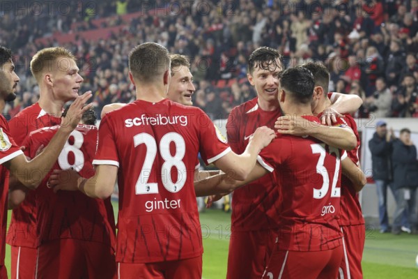 Cheers, hustle and bustle - Vincenzo Grifo (SC Freiburg) is celebrated by his colleagues after scoring the 2-0 goal during the DFB Cup 2024-25, 2nd round: SC Freiburg vs Hamburger SV, Freiburg im Breisgau, Germany / Germany