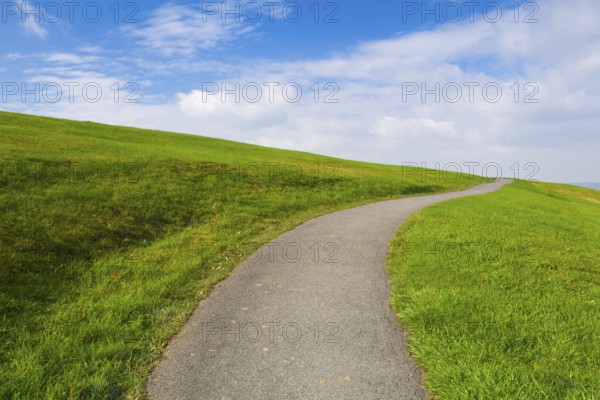Autumn scene with empty road on the hills