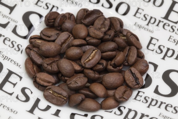 Coffee beans on a coffee saucer