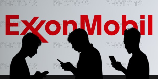 ExxonMobil Corporation Logo on a mobile screen stock image. It's a major multinational publicly traded oil and gas company:
