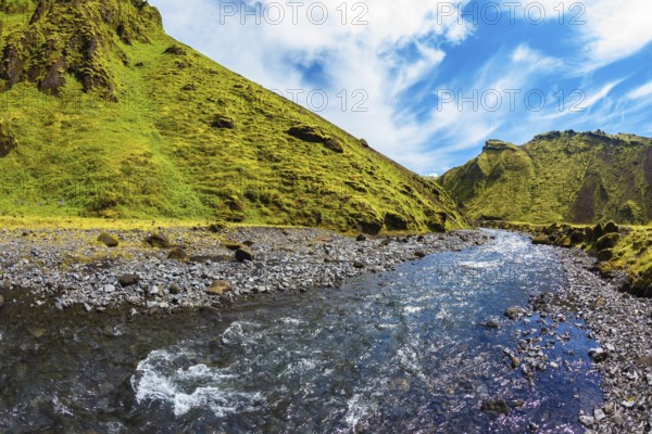 The canyon Pakgil fast flowing shallow stream. Scenic summer Iceland. The photo was taken Fisheye lens