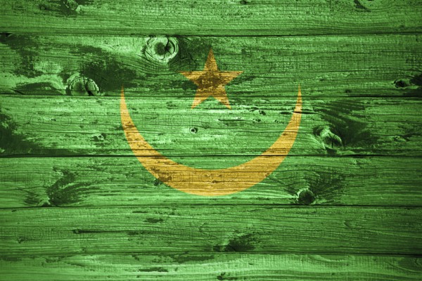 Mauritania flag on wooden planks background wood flag