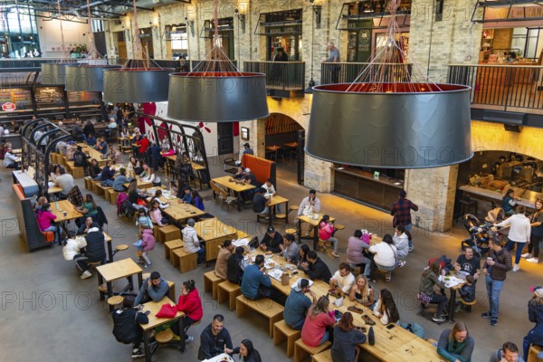 People enjoying food in The Forks Market in Winnipeg, Canada