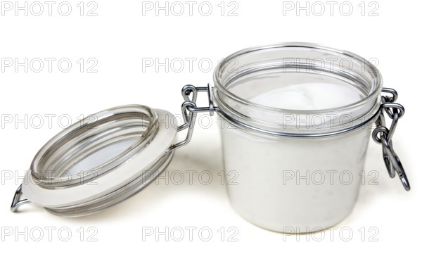 Jar of cream with a steel lock on a white background