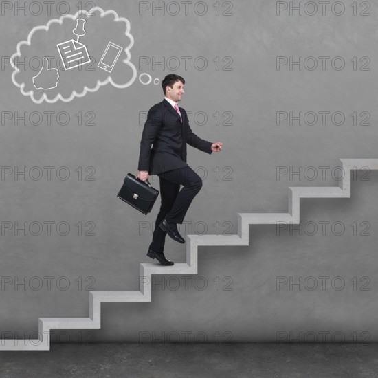 Image of confident businessman with briefcase walking upstairs