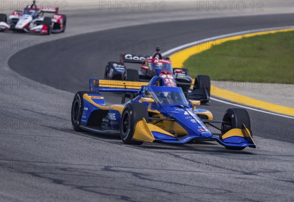 NTT INDYCAR SERIES driver, KYFFIN SIMPSON (R) (4) (BRB) of Bridgetown, Barbados races through the turns during the Hy-Vee Milwaukee Mile 250's at The Milwaukee Mile in West Allis, WI, West Allis, United States of America