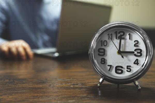 The clock shows three o'clock in the afternoon. Working hours are in full swing