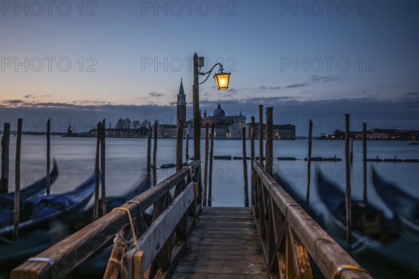 Morning atmosphere, Venetian gondolas with the church of San Giorgio Maggiore in the background, Venice, UNESCO World Heritage Site, Veneto, Italy