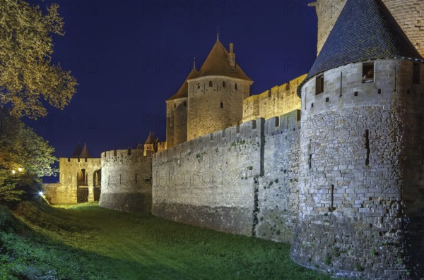 Cite de Carcassonne is a medieval citadel located in the French city of Carcassonne. Towers and wal in Evening