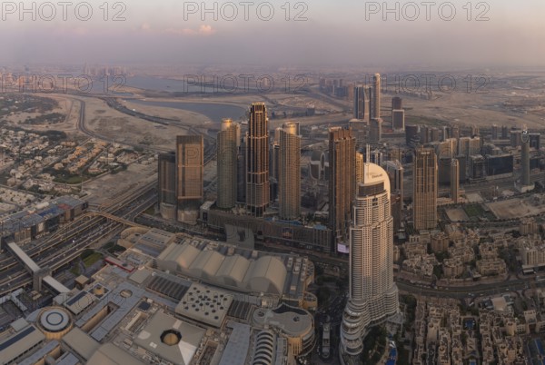 A picture of Downtown Dubai, with the Dubai Mall and the Address Downtown Hotel a the bottom, at sunset
