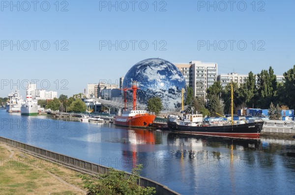Kaliningrad, Russia, September 29, 2020. Museum display ship. An exhibit of the. Embankment of the maritime museum. Circular sphere building