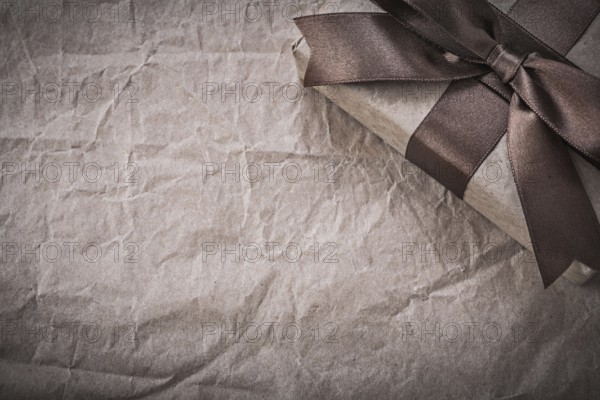 Wrapped present box on wrapping paper holidays concept