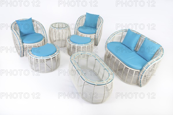 Suite of wicker furniture made of synthetic fibre on isolated background