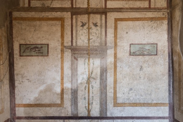 POMPEII, ITALY, MAY 04, 2022, Scenic ancient frescoes in a room of a Pompeiian villa, Southern Italy
