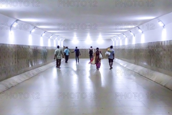 People walking in underpass, Lake Town, Kolkata, West Bengal, India, Asia