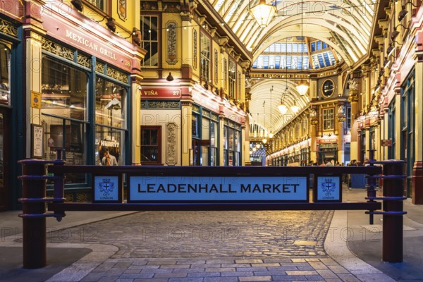London Leadenhall Market entrance showcases stunning Victorian architecture, warm lighting, and historic charm