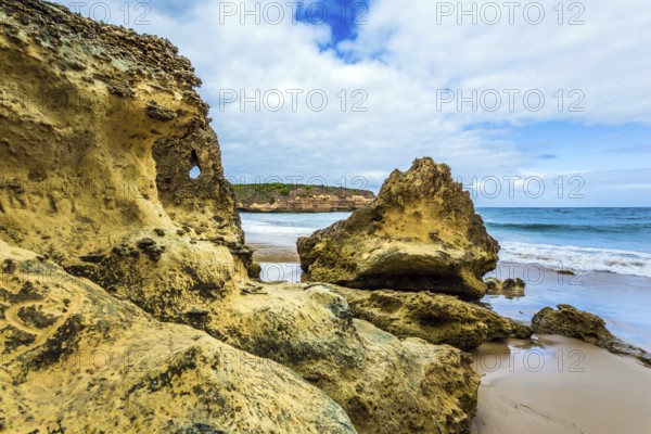 Picturesque coastal cliffs and a powerful surf of the Pacific Ocean. The Great Ocean Road of Australia. The concept of exotic, active and photo-tourism