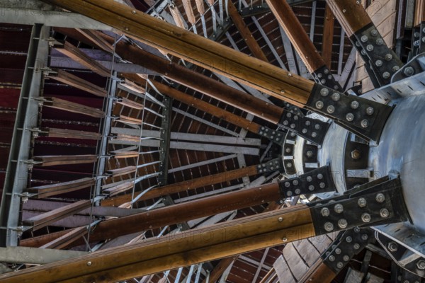 View of wooden observation tower taken from ground level looking up through levels of structure in South Korea