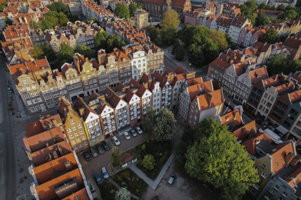 Beautiful panoramic architecture of old town in Gdansk, Poland at sunrise. Aerial view drone pov. Landscape cityscape City from Above. Small vintage historical buildings Europe Tourist Attractions travel destination in Gdansk