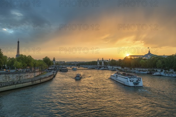 Paris France, city skyline sunset at Seine River with Pont Alexandre III bridge and Grand Palais