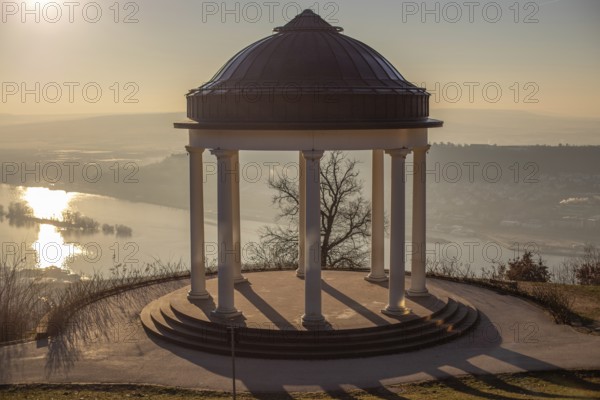 Beautiful temple in a landscape shot. Sunrise on a winter morning. Beautiful view along the Rhine at the Niederwaldtempel, Niederwalddenkmal, Hesse, Germany