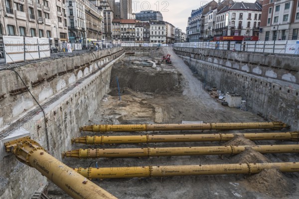 Brussels Old Town, Belgium, 05 22 2019, The construction site of the ancien demolished Parking 58 with a large concrete foundation and metal foundation poles of the brand Groundforce